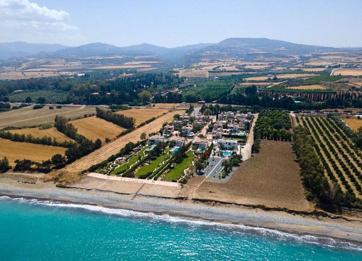 Villa in seafront development by beach