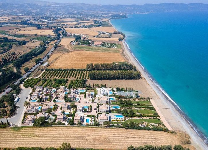 Villa in seafront development by beach