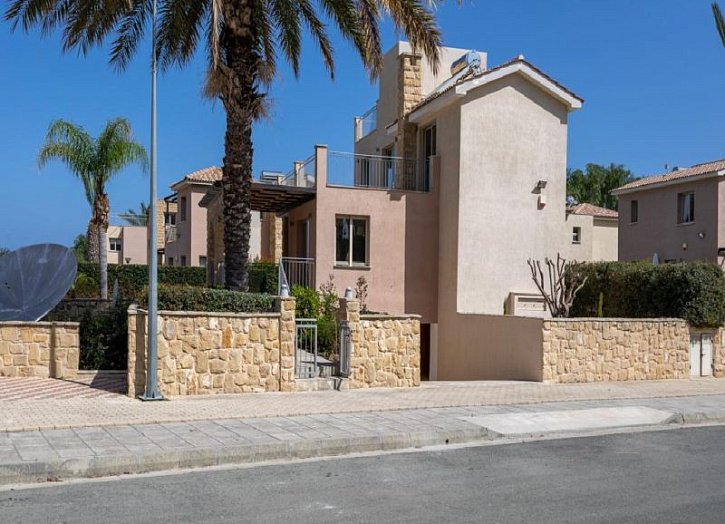 Villa in seafront development by beach
