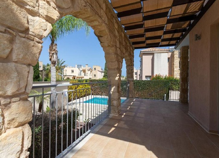 Villa in seafront development by beach