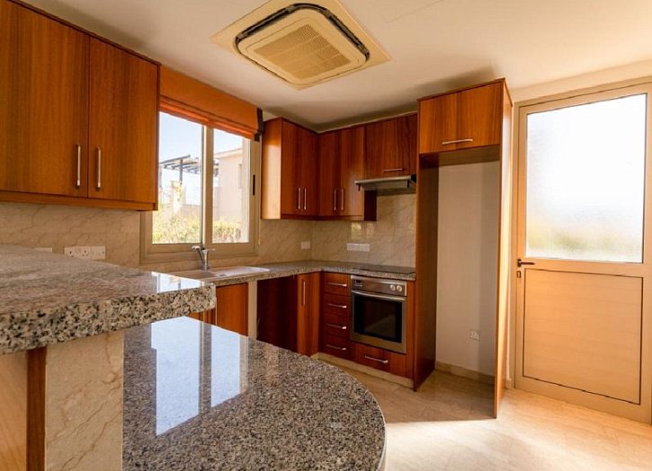 Villa in seafront development by beach