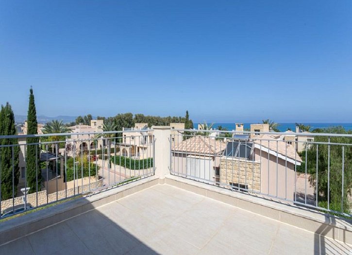 Villa in seafront development by beach