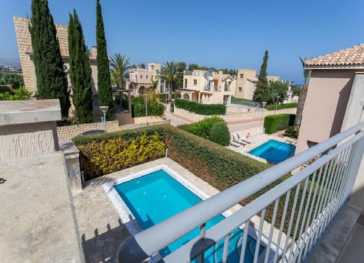 Villa in seafront development by beach