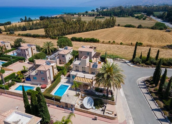 Villa in seafront development by beach